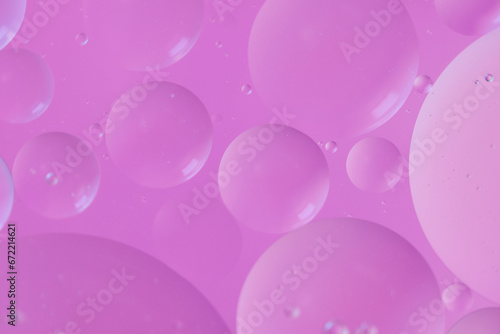 Top view oil bubbles drop on the water with colorful background, Macro photography concept
