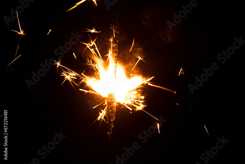Burning sparkler on a black background. close-up. new year