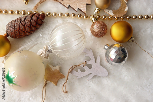 Various colorful Christmas oranments and white faux fur blanket. Top view. photo