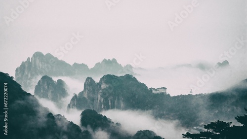 Dramatic landscape of foggy mountains in the distance: Huangshan National park China