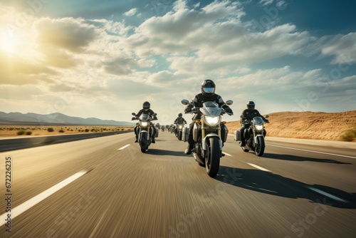 A group of motorcyclists ride motorcycles together on an empty road. © Jang