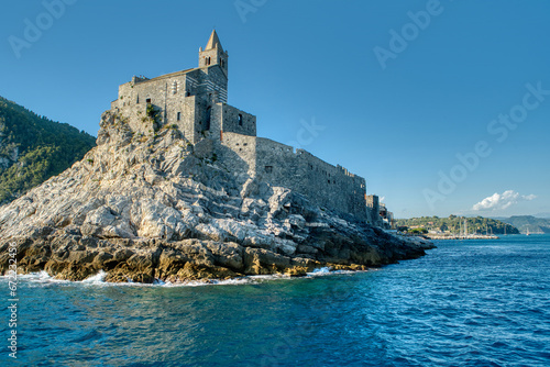 View of Church of St. Peter in Portovenere or Porto Venere town on Ligurian coast in the province of La Spezia. Cinque Terre coast or Italian Riviera. Porto Venere, Liguria, Italy