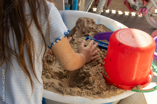 child playing with sand