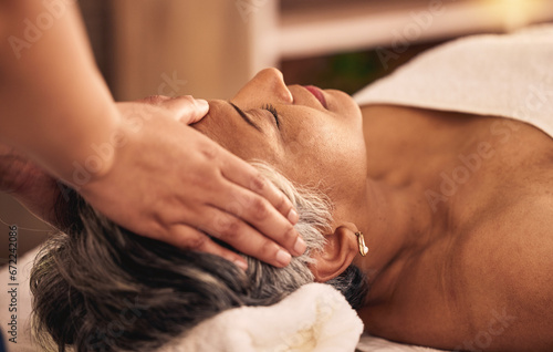 Woman  facial and head massage at spa for beauty  skincare treatment and healing at cosmetics salon. Face of calm mature female client relax at wellness resort for reiki  acupressure and zen therapy