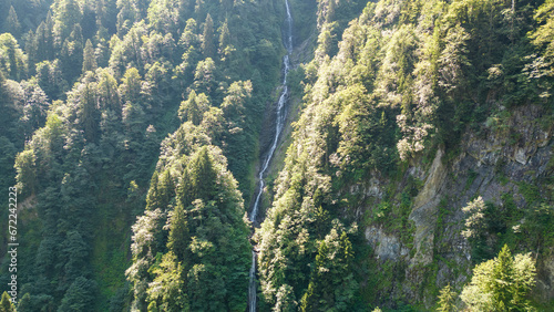 Tar stream cloud waterfall. Aerial view of waterfall flowing over mountain covered with forest. Natural beauties of Rize. Tourist places of Turkey. local name tar deresi bulut selalesi photo