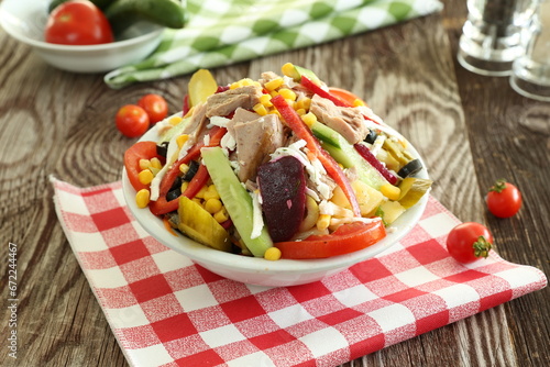Healthy salad with tuna fish, radish, pepper, tomato and cheese 