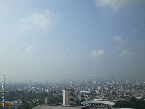 High angle view jakarta indonesia city scape with tower building, highway street and green public park