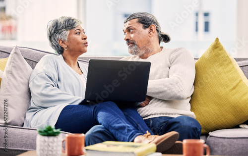 Laptop, planning and senior couple on a sofa for streaming, sign up or subscription discussion in their home. Retirement, relax and old people on online in a living room for internet, movie or search