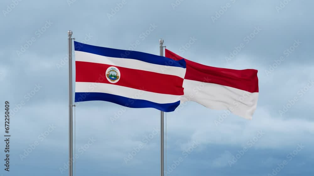 Indonesia flag and Costa Rico flag waving together on cloudy sky, endless seamless loop, two country relations concept Indonesia flag and Costa Rico flag waving together on cloudy sky, endless seamless loop, two country relations concept