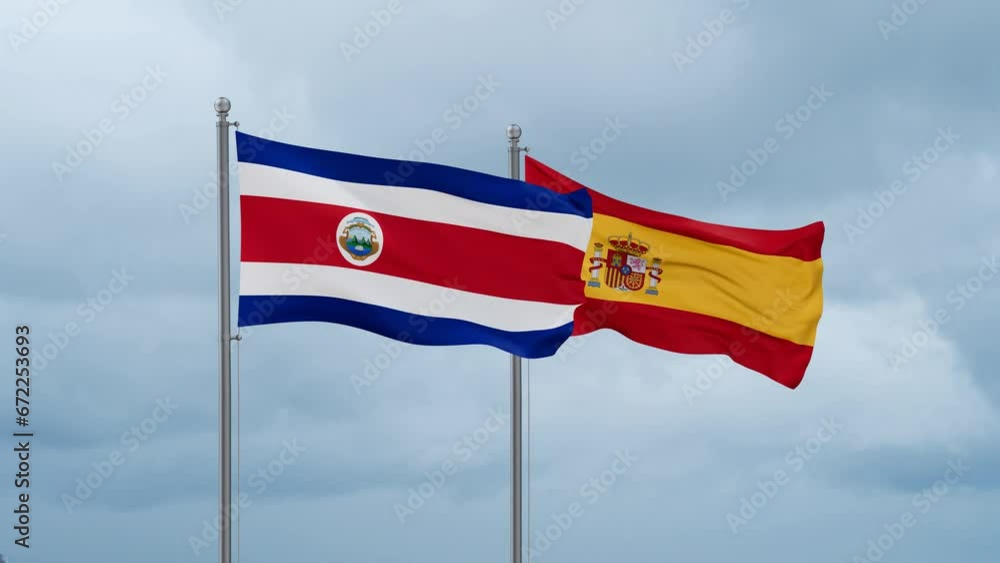 Spain and Costa Rico flag waving together on cloudy sky, endless seamless loop, two country cooperation concept Spain and Costa Rico flag waving together on cloudy sky, endless seamless loop, two country cooperation concept