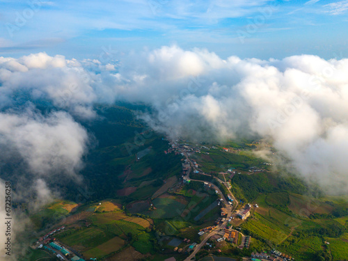 Top view Aerial photo from flying drone over white clouds ,Mountains and winding road mountain paths exciting steep at Phu Thap Boek ,Phetchabun Province,Thailand,ASIA. © noon@photo