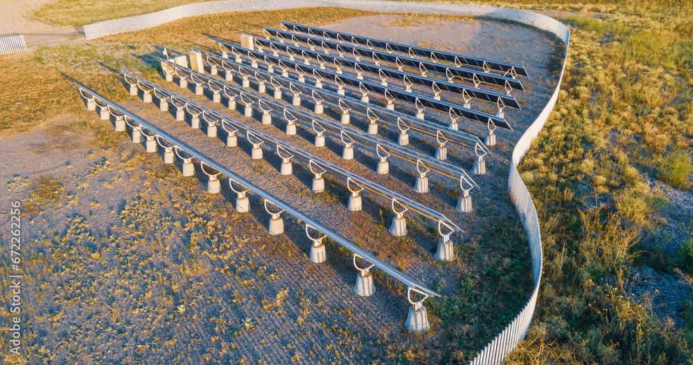 Fototapeta premium Not the front side of solar panels installed on concrete piles