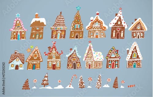 Set of gingerbread houses, christmas sweets and snowy fir trees on grey background
