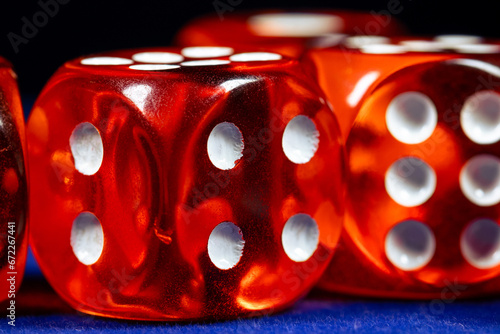 Red dice close-up on a blue casino table