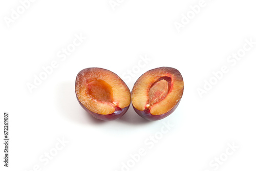 Halves purple plum isolated on white background. .