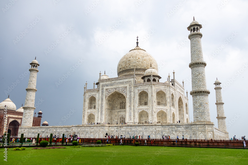 View of the imposing Taj Mahal in Agra, India, with its wonderful architecture and gardens on a cloudy day