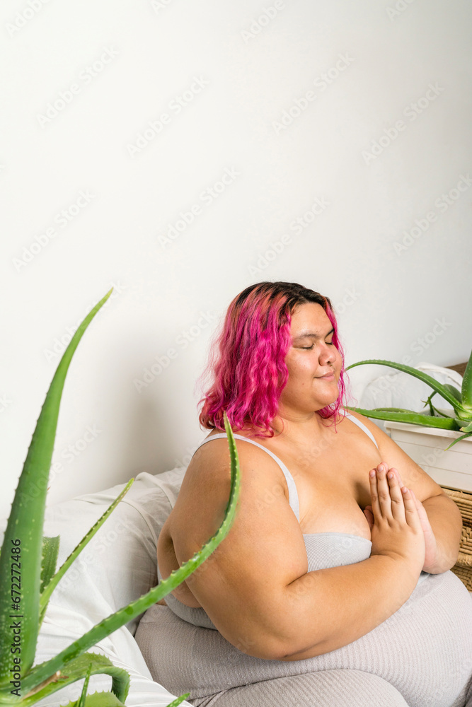 Woman relaxing sitting down on the couch meditation Woman relaxing sitting down on the couch meditation
