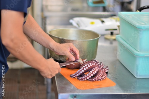 man cooking octopus