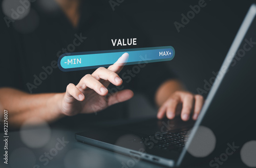Businessman point to show the virtual process for progress bar of increasing value added to business product and service concept. Quality control, benefit growth and development in business. photo