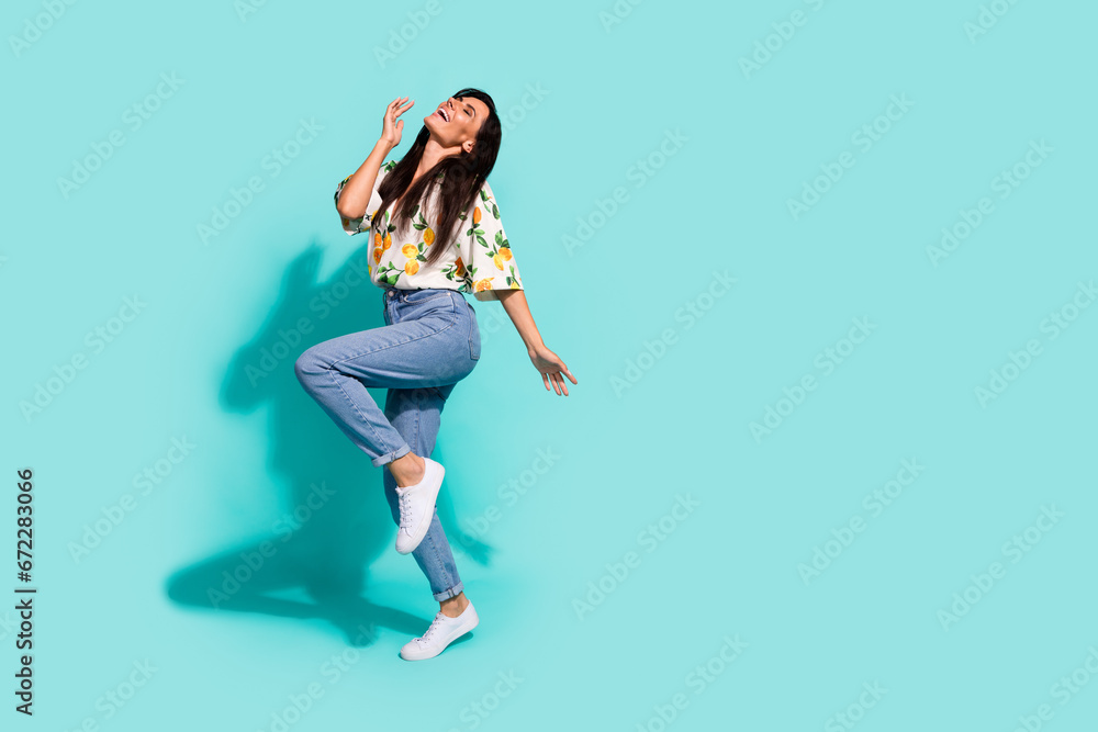 Full size photo of nice woman with long hairstyle dressed flower print blouse enjoy music dancing isolated on turquoise color background