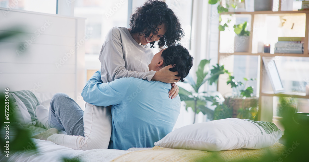 Hug, home bed and couple kiss with love, care and support in a bedroom with relax and bonding. Embrace, happy young people and smile in a house with a woman and man together with romance in morning Hug, home bed and couple kiss with love, care and support in a bedroom with relax and bonding. Embrace, happy young people and smile in a house with a woman and man together with romance in morning