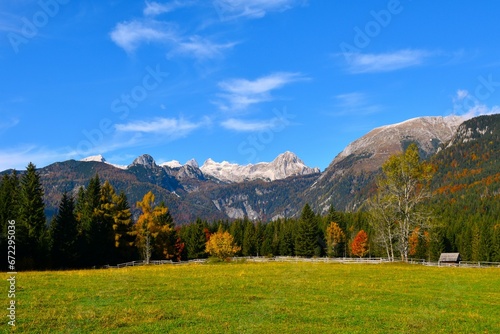 View of Miseljski vrh and Ogradi mountain from Uskovnica alpine pasture in Julian alps, Gorenjska, Slovenia in autumn