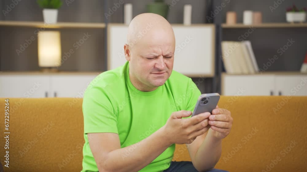 Man looking at the phone in amazement. Man looking at the phone in amazement.