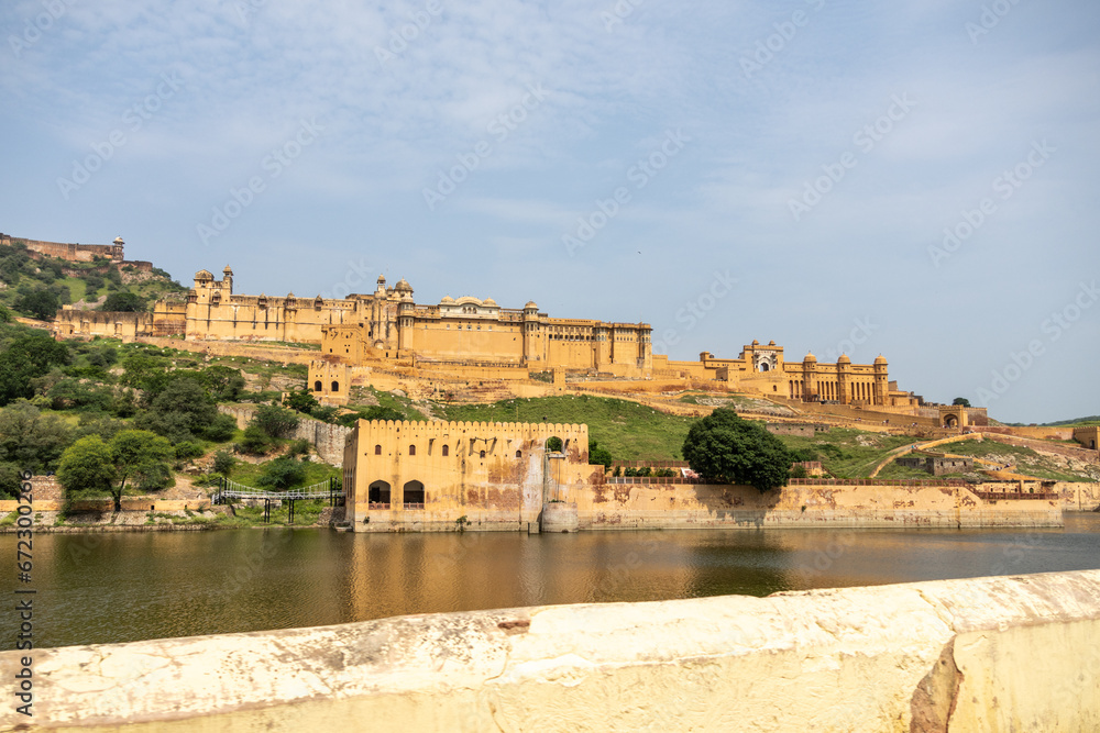 Full view of Amber Fort in daytime with cloudy sky, near Jaipur, The Pink City, Rajasthan, India