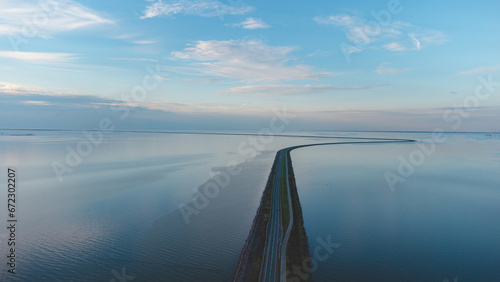 Aerial view of the man-made road through the North Sea to another part of the Northern Netherlands. Unique transport construction
