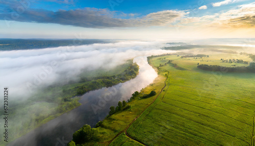 Aerial view of beautiful landscape of foggy river and green fields