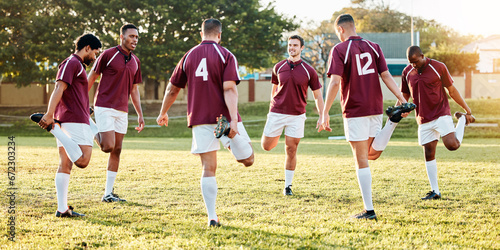 Rugby, sports and stretching with a team getting ready for training or a competitive game on a field. Fitness, sport and warm up with a man athlete group in preparation of a match outdoor in summer photo
