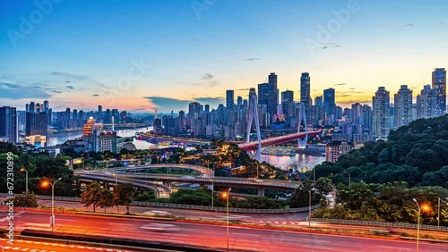 Day-to-night time-lapse photography of Chongqing city viaduct and city center skyline at sunrise photo