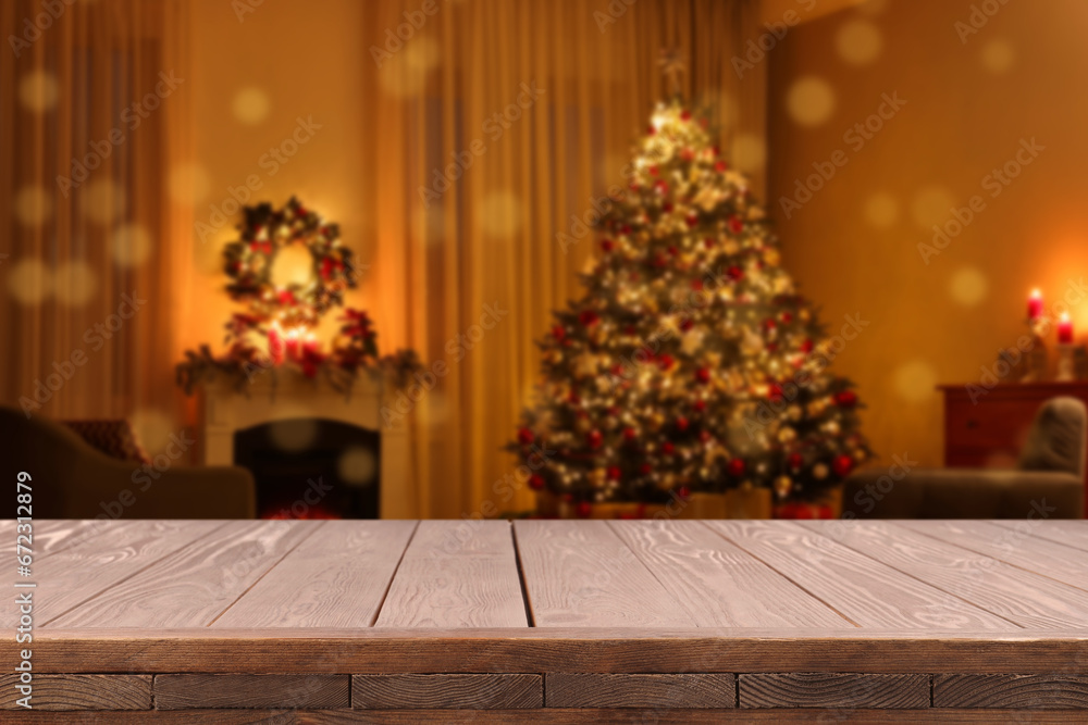 Wooden table in room decorated for Christmas. Space for design Wooden table in room decorated for Christmas. Space for design