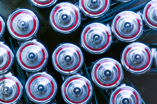 Battery,Closeup of pile of used alkaline batteries. Close up colorful rows of selection of AA batteries energy abstract background of colorful batteries. Alkaline battery aa size. Several batteries in photo