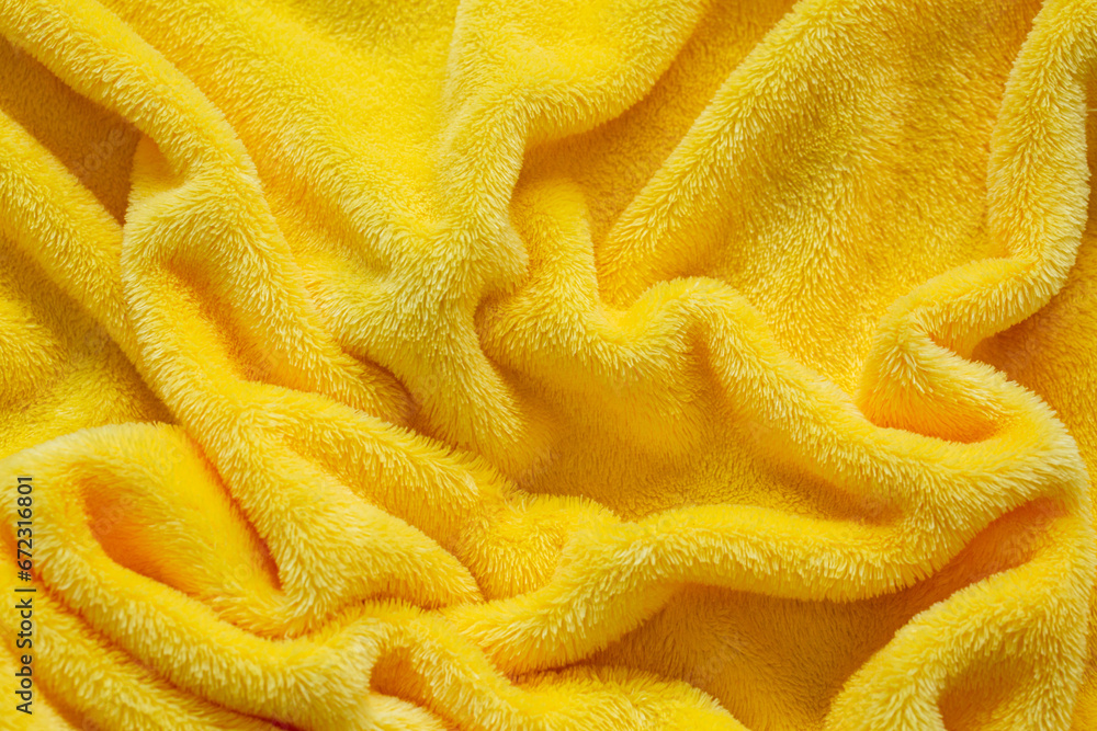 Macro yellow towel background,Terry cloth, yellow towel texture background. Soft fluffy textile bath or beach towel material Macro yellow towel background,Terry cloth, yellow towel texture background. Soft fluffy textile bath or beach towel material