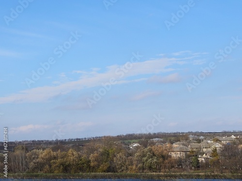 A landscape with trees and buildings © parpalac