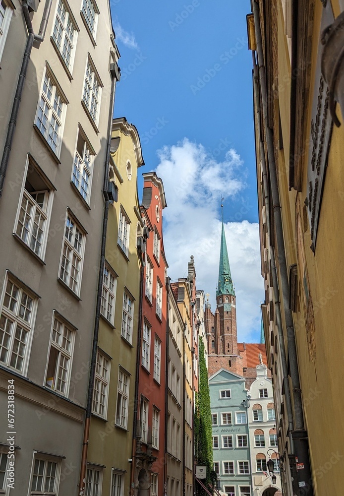 Narrow alleyway featuring historic buildings in the center of Gdansk, Poland