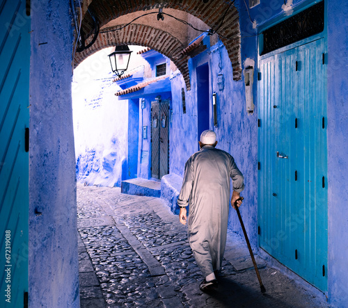 local walking on the blue streets of Chefchaouen Morocco © Agata Kadar