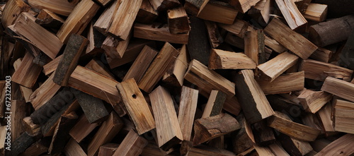 stacked dry firewood as a background photo