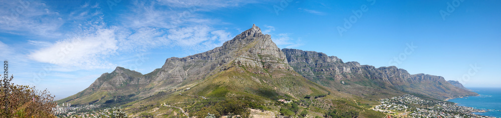 Landscape of a mountain against a blue sky with copyspace. A popular travel destination for tourists and hikers to explore. View of Table Mountain and the twelve apostles in Cape Town, Western Cape