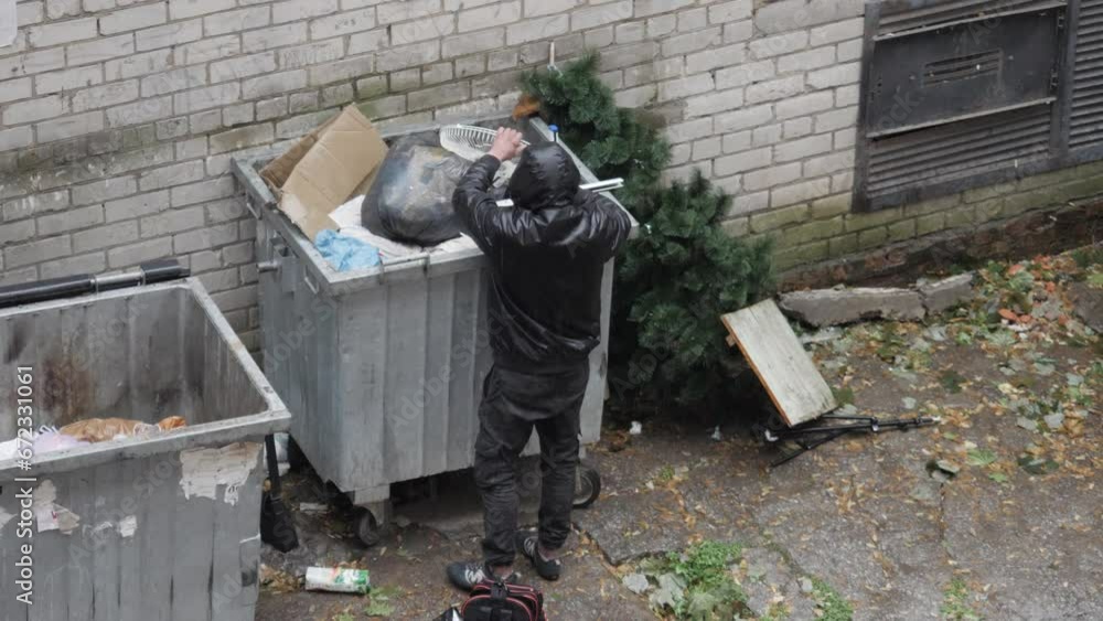 Male Homeless Looking For Food In Trash Can
Male Homeless Looking For Food In Trash Can