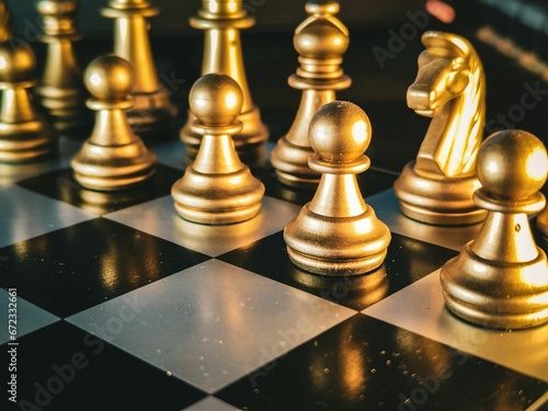 Картината върху платно Classic wooden chess board with golden chess pieces