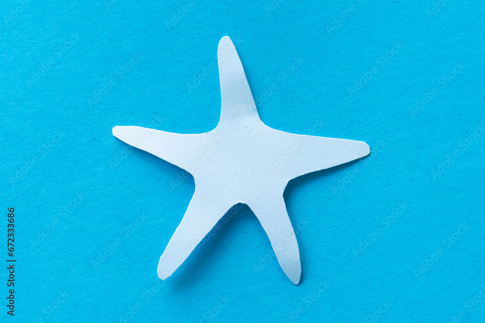 starfish paper cut isolated on blue starfish paper cut isolated on blue