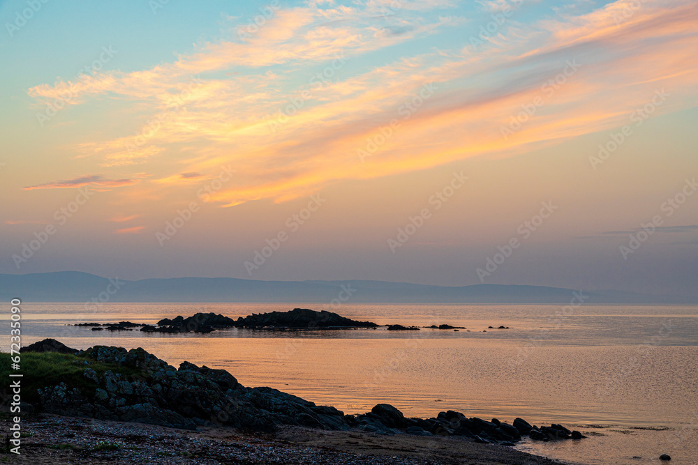 Pre dawn coastal cloudscape on a rocky beach near Peninver on the Kintyre Peninsula, Argyll & Bute, Scotland UK Pre dawn coastal cloudscape on a rocky beach near Peninver on the Kintyre Peninsula, Argyll & Bute, Scotland UK