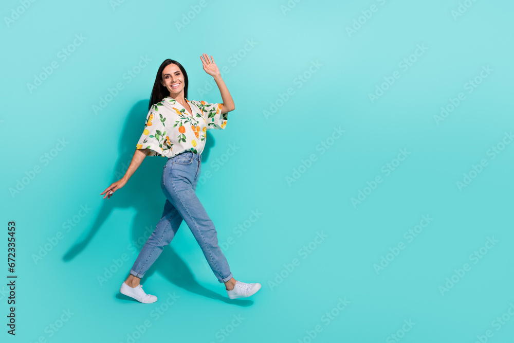 Full length photo of adorable lovely girl wear trendy outfit going date meeting greeting you empty space isolated on cyan color background Full length photo of adorable lovely girl wear trendy outfit going date meeting greeting you empty space isolated on cyan color background