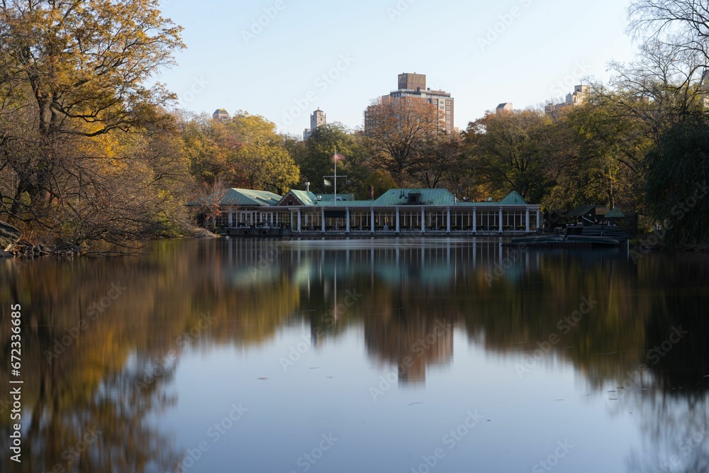 Central Park boat house near the lake in central park, New York city surrounded by autumn trees