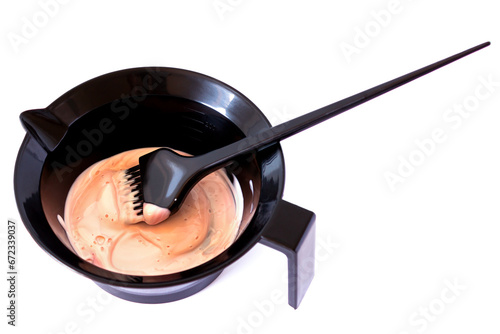 Mixing hair dye in a special plastic bowl. Accessories for hair coloring. Isolated on white.