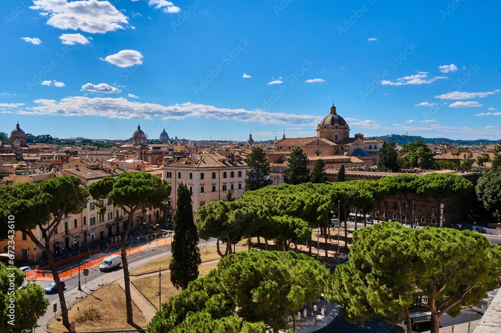 Scenic view of an ancient cityscape of Rome, featuring a grand dome in the center