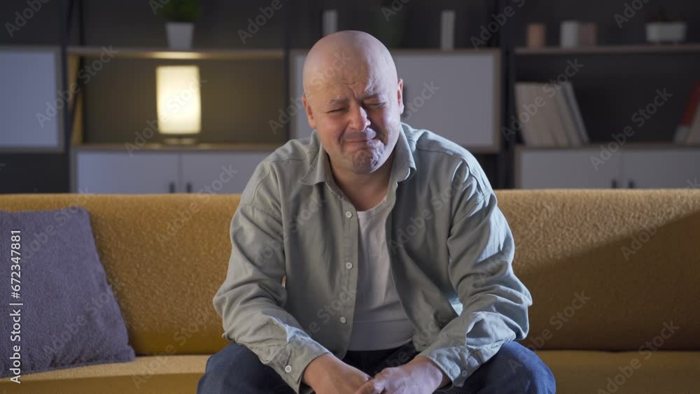 Depressed crying man at home alone. Depressed crying man at home alone.