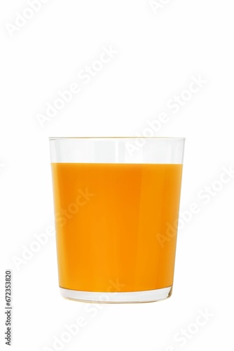 Tall glass of orange juice sits on a bright white background photo